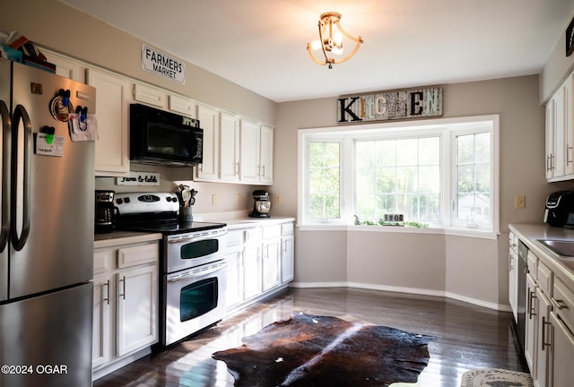 2652 S Farm Rd 51, Republic, MO 65738 - kitchen featuring appliances with stainless steel finishes, light countertops, dark wood-style floors, and white cabinets
