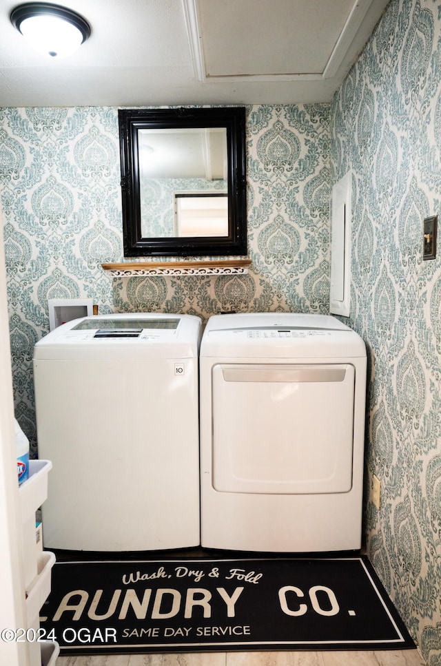 2652 S Farm Rd 51, Republic, MO 65738 - washroom with wallpapered walls and washing machine and clothes dryer