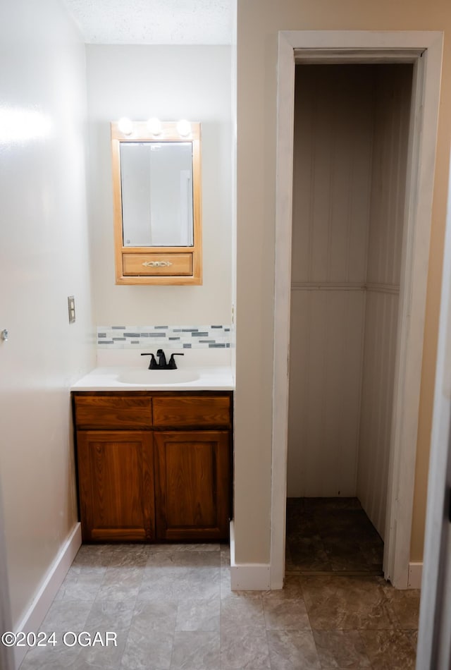 2652 S Farm Rd 51, Republic, MO 65738 - bathroom with vanity and tasteful backsplash