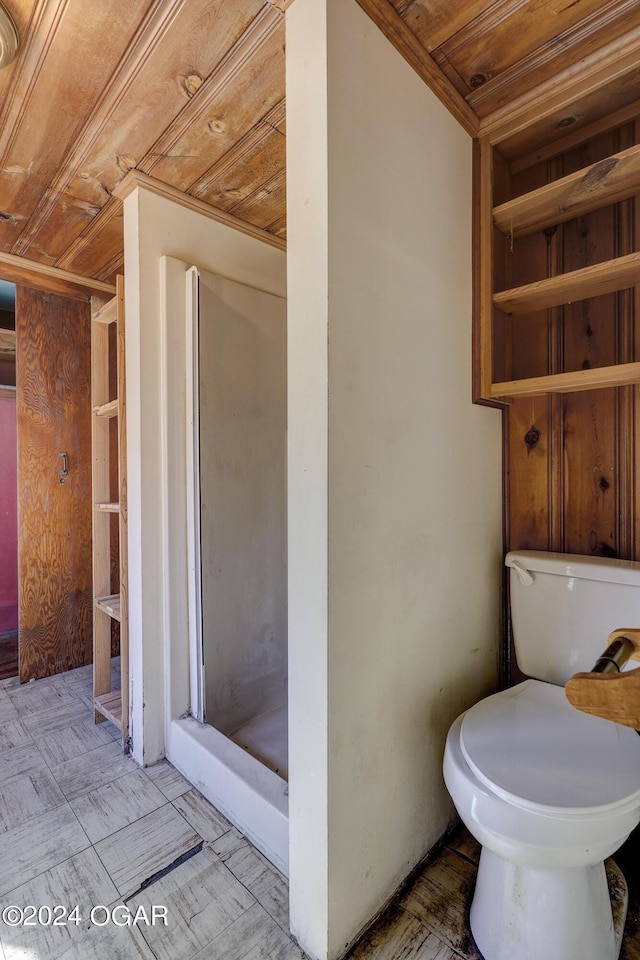 bathroom with toilet, wooden ceiling, and walk in shower