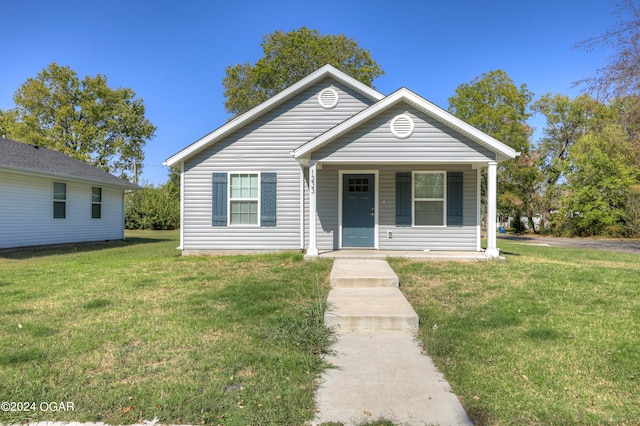 bungalow-style home with a porch and a front yard