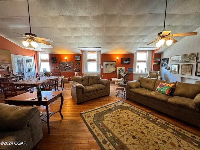 living room featuring ceiling fan, a healthy amount of sunlight, and hardwood / wood-style floors