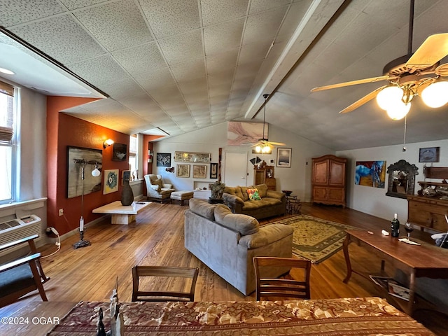 living room featuring lofted ceiling, hardwood / wood-style flooring, and ceiling fan