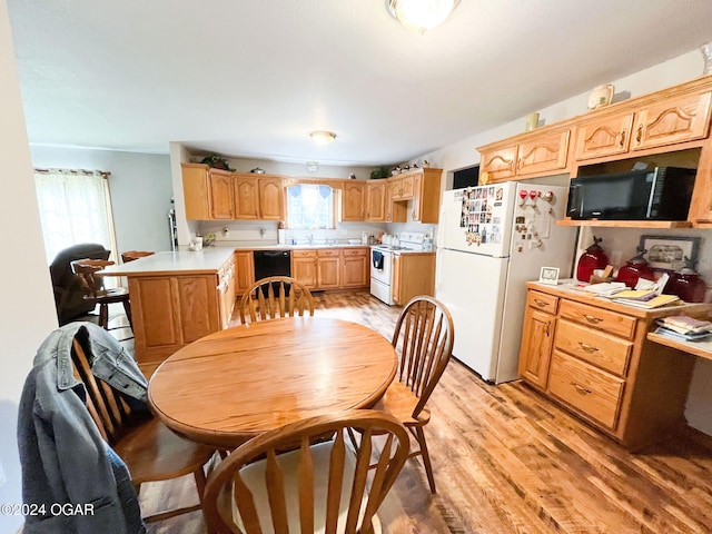 dining area featuring light wood-type flooring