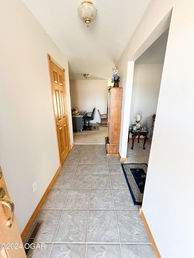 corridor with carpet flooring