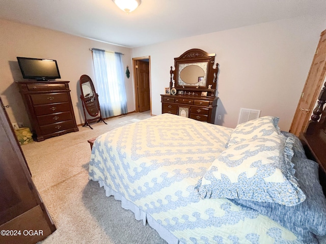 bedroom with light colored carpet