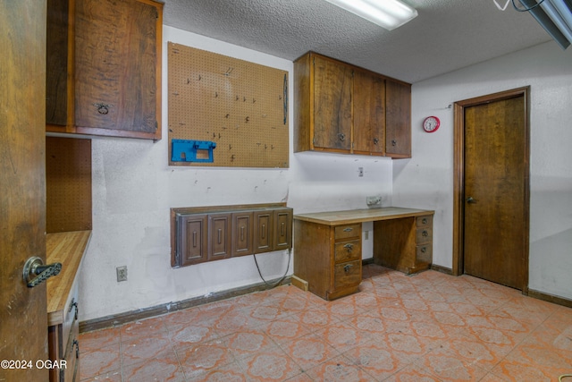 kitchen with a textured ceiling