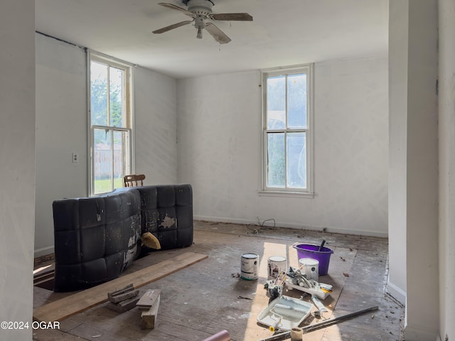 unfurnished room featuring ceiling fan and a wealth of natural light