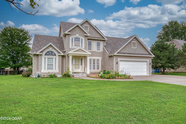 craftsman-style house with a front yard and a garage