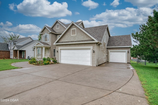 craftsman-style home with a front yard and a garage