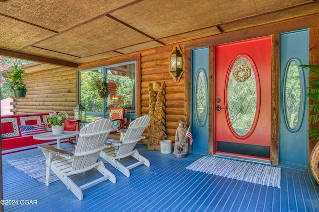 property entrance with covered porch