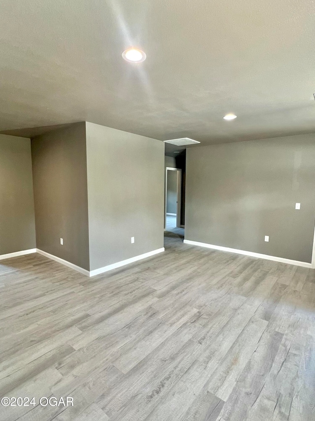 spare room with light hardwood / wood-style floors