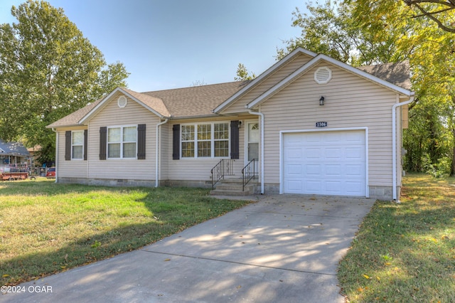 single story home with a front yard and a garage