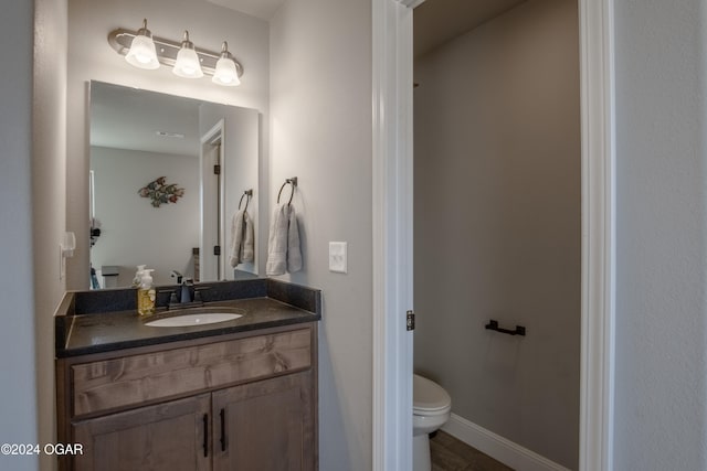 bathroom with vanity and toilet