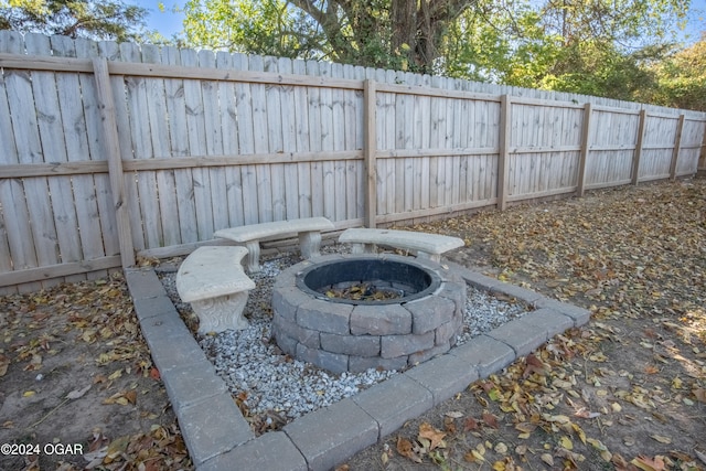 view of yard with a fire pit