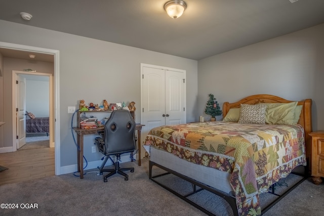 bedroom with a closet and hardwood / wood-style floors