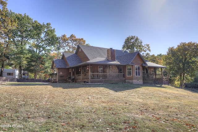 view of front facade featuring a front lawn and covered porch