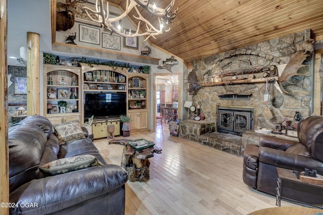 living room featuring a fireplace, wood ceiling, a notable chandelier, high vaulted ceiling, and light hardwood / wood-style flooring