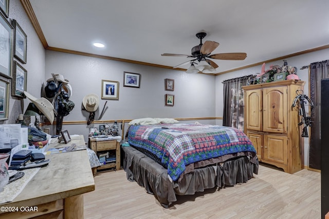 bedroom featuring ornamental molding, light hardwood / wood-style floors, and ceiling fan