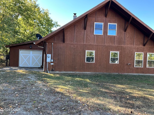 view of home's exterior with a lawn