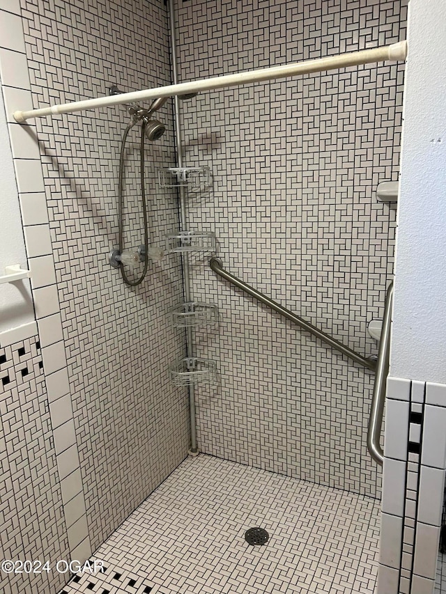 bathroom with tiled shower