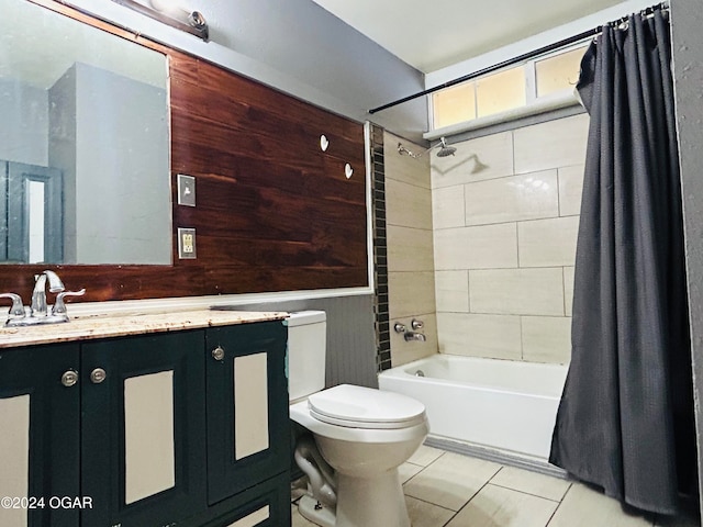 full bathroom featuring vanity, shower / bath combo with shower curtain, toilet, and tile patterned floors