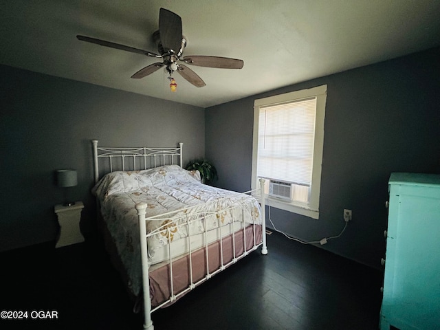 bedroom with dark hardwood / wood-style flooring, cooling unit, and ceiling fan