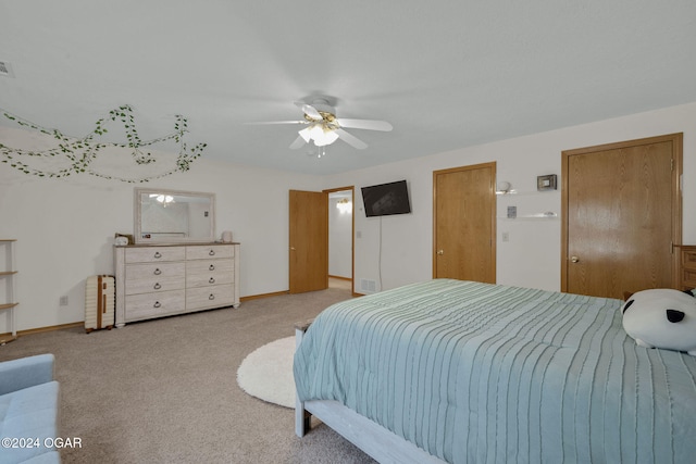 carpeted bedroom with ceiling fan