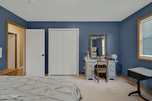 carpeted bedroom with a closet