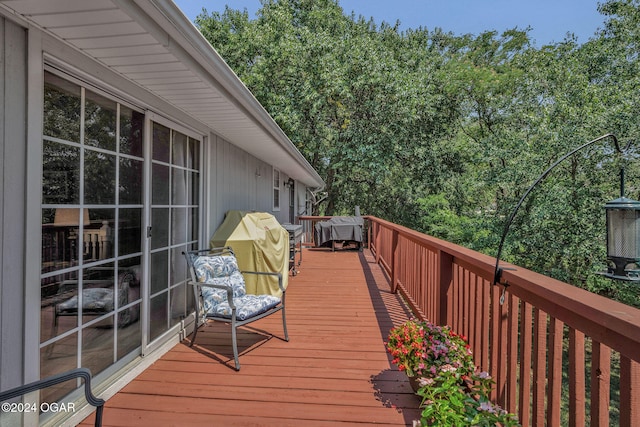 wooden terrace with area for grilling