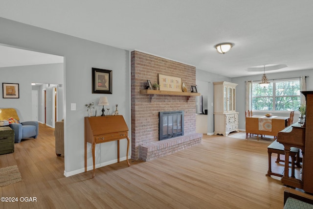 living room with a fireplace and light hardwood / wood-style floors