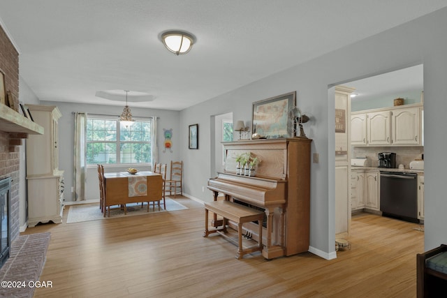 interior space with a fireplace and light hardwood / wood-style floors