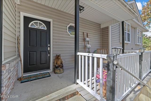 view of exterior entry with covered porch