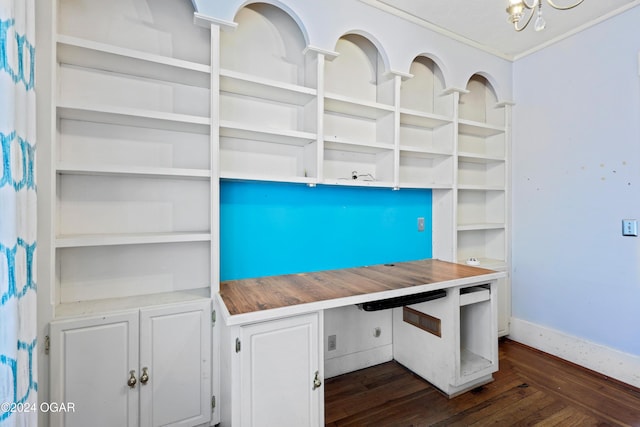 unfurnished office with dark wood-type flooring and a chandelier