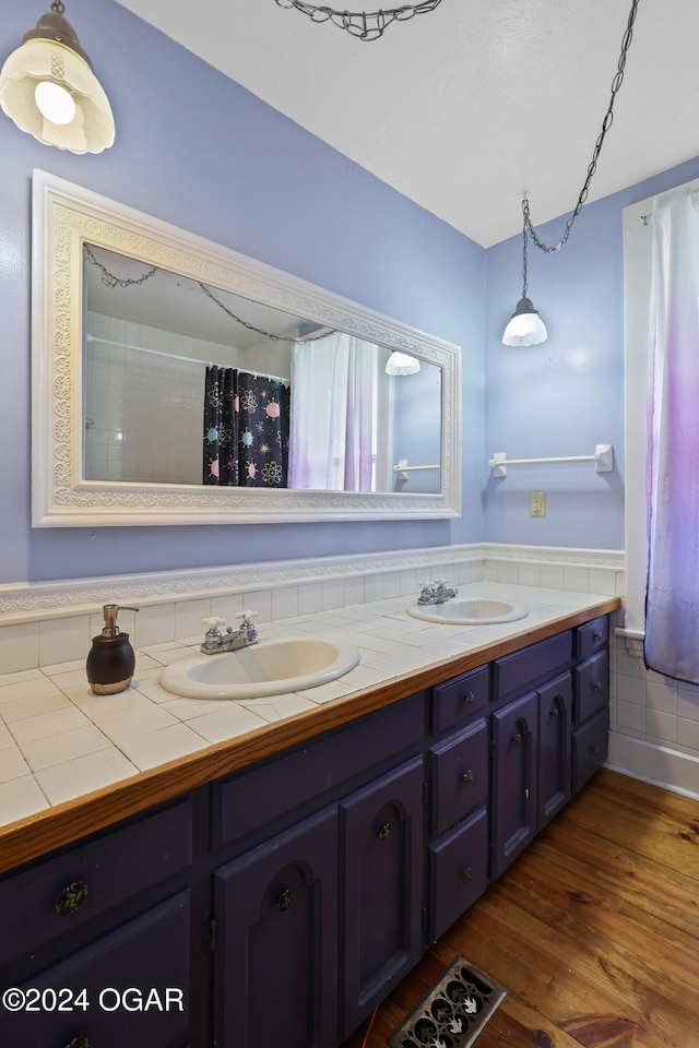 bathroom with vanity and hardwood / wood-style floors