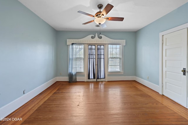 spare room with ceiling fan and hardwood / wood-style floors