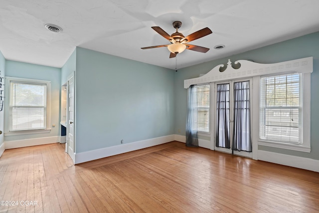 empty room featuring light hardwood / wood-style flooring and ceiling fan