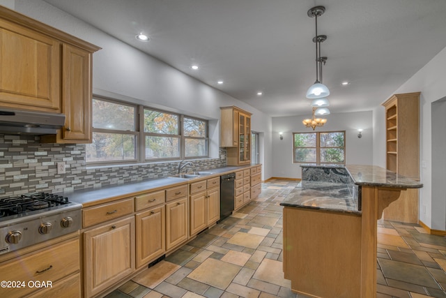 kitchen featuring a center island, black dishwasher, stainless steel gas cooktop, exhaust hood, and a breakfast bar