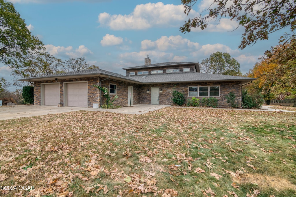 prairie-style house featuring a garage