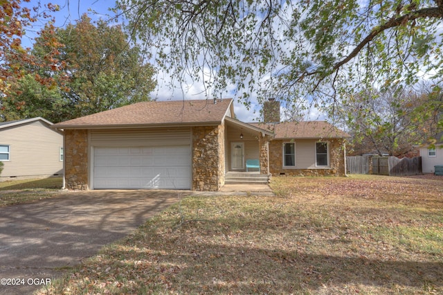 ranch-style home featuring a garage