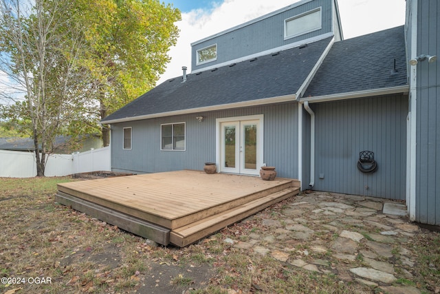 rear view of property featuring french doors and a wooden deck