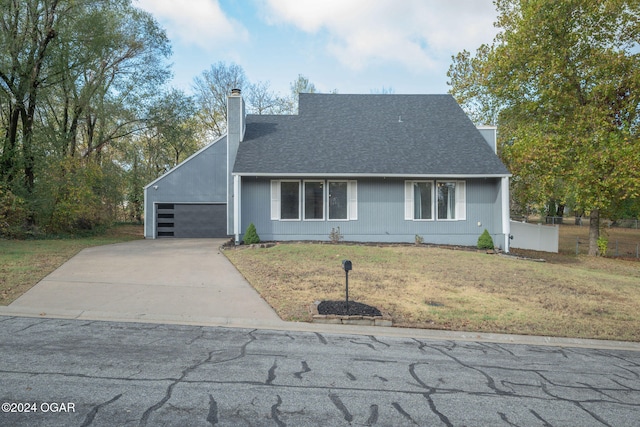 view of front facade featuring a garage and a front lawn