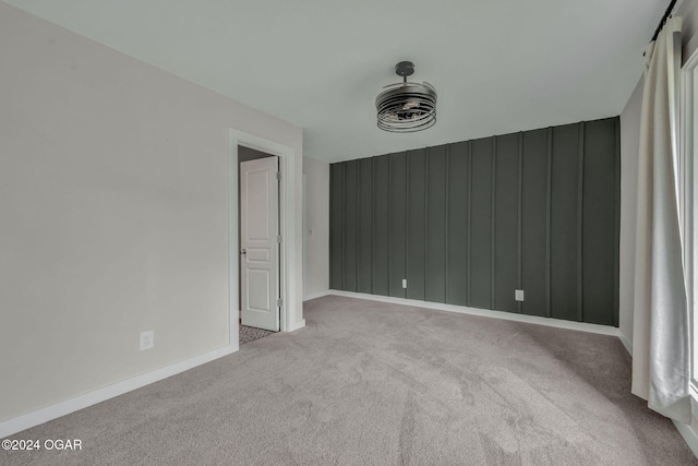 empty room with light colored carpet