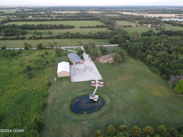 birds eye view of property featuring a rural view