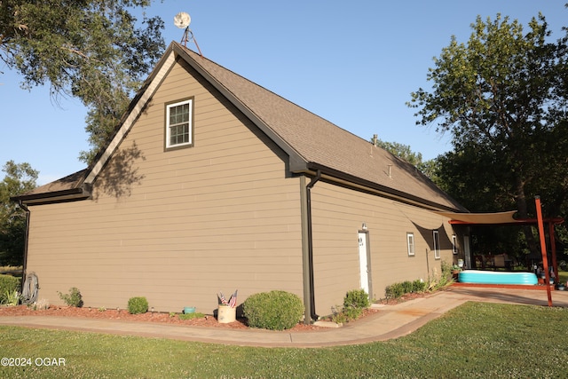 view of property exterior with a lawn