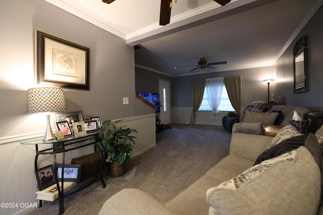 carpeted living room with crown molding and ceiling fan