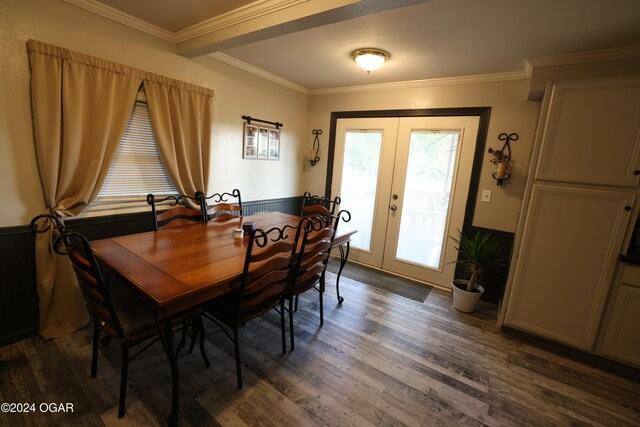 dining space featuring french doors, dark wood-type flooring, and crown molding