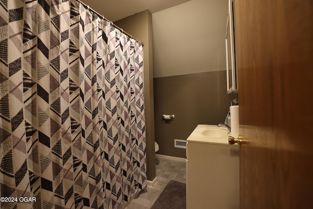 bathroom with vanity, toilet, and a shower with curtain