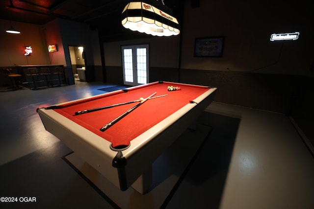 playroom with concrete floors, french doors, bar, and billiards