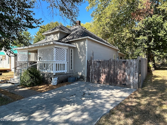 view of side of property featuring a deck